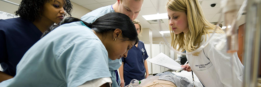 Health professional learners participate in an interprofessional critical care simulation.